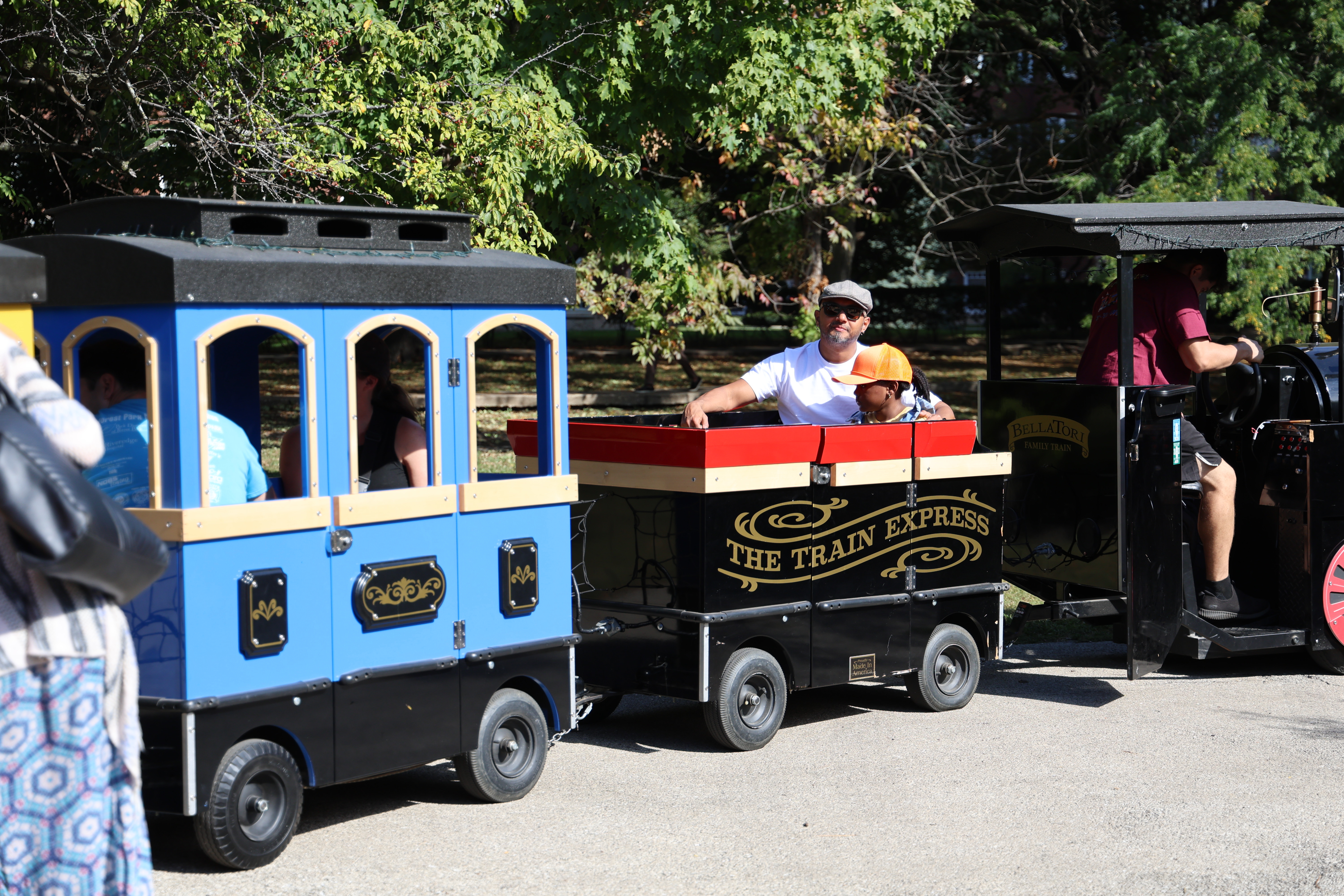 People riding "The Train Express" outdoor train.